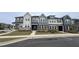 Attractive new construction townhomes with multi-tone facade and meticulous landscaping at 803 Courting St, Apex, NC 27523