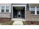 Charming covered front porch with dark-stained wood accents and craftsman-style features at 803 Courting St, Apex, NC 27523
