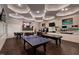 Game room with ping pong, pool tables, and arcade machines for endless fun and entertainment at 803 Courting St, Apex, NC 27523