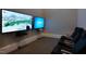 Game room with large screens, comfortable seating, and gaming consoles for entertainment at 803 Courting St, Apex, NC 27523