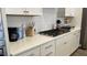 Modern kitchen featuring white cabinets, quartz countertops, white subway tile backsplash, and stainless steel appliances at 803 Courting St, Apex, NC 27523