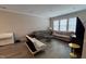 Spacious living room with a futon, sofas, and light hardwood floors at 803 Courting St, Apex, NC 27523