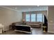 Bright living room featuring neutral walls, hardwood floors, and comfortable seating, perfect for relaxing or entertaining at 803 Courting St, Apex, NC 27523