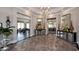 Grand lobby entrance with elegant decor, marble floors, and open access to dining and living areas at 803 Courting St, Apex, NC 27523