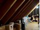 Spacious attic area for storage with exposed rafters and various stored boxes at 8620 Brookdale Dr, Raleigh, NC 27613