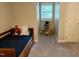 Bedroom with a twin bed, carpet flooring, and a nook for a small table or play area at 8620 Brookdale Dr, Raleigh, NC 27613