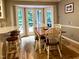 Cozy dining area with a table, chairs, and natural light through French doors at 8620 Brookdale Dr, Raleigh, NC 27613