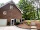 Charming brick home featuring a well-maintained yard and a walkway with steps at 8620 Brookdale Dr, Raleigh, NC 27613