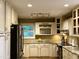 Well-equipped kitchen features stainless steel appliances and modern lighting at 8620 Brookdale Dr, Raleigh, NC 27613