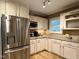 Modern kitchen with stainless steel appliances and granite countertops at 8620 Brookdale Dr, Raleigh, NC 27613