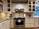 Kitchen features granite counters, stainless steel appliances, and ample storage at 8620 Brookdale Dr, Raleigh, NC 27613
