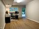 Home office space with hardwood floors, a desk, and natural light, providing a functional workspace at 8620 Brookdale Dr, Raleigh, NC 27613