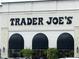 Exterior of Trader Joe's featuring the Trader Joe's logo and a row of awnings at 8620 Brookdale Dr, Raleigh, NC 27613