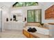 Bathroom with double vanity, soaking tub and natural light at 8821 Oconee Ct, Chapel Hill, NC 27516