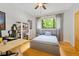 Cozy bedroom features a bed, desk, and shelving unit, perfect for work or relaxation at 8821 Oconee Ct, Chapel Hill, NC 27516