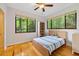This bedroom is bright with a natural view from the two large windows at 8821 Oconee Ct, Chapel Hill, NC 27516