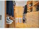 Walk-in closet with custom shelving, storage and hardwood floors at 8821 Oconee Ct, Chapel Hill, NC 27516