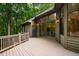 Spacious deck built with natural wood material overlooking a scenic wooded yard at 8821 Oconee Ct, Chapel Hill, NC 27516