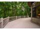 Well-built deck overlooks a yard filled with full, green trees at 8821 Oconee Ct, Chapel Hill, NC 27516