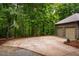 Wide driveway with a basketball hoop leads to an attached two-car garage at 8821 Oconee Ct, Chapel Hill, NC 27516