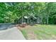 Charming home surrounded by mature trees and landscaped yard at 8821 Oconee Ct, Chapel Hill, NC 27516
