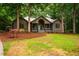 Charming home exterior featuring a landscaped front yard and a inviting covered front porch at 8821 Oconee Ct, Chapel Hill, NC 27516