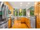 Eat-in kitchen with stainless steel appliances and large windows at 8821 Oconee Ct, Chapel Hill, NC 27516