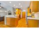 Open-concept kitchen with a view of the living room and fireplace at 8821 Oconee Ct, Chapel Hill, NC 27516