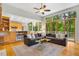 Open-concept living room with hardwood floors and large windows offering scenic views at 8821 Oconee Ct, Chapel Hill, NC 27516
