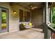 Relaxing porch featuring a swing, ceiling fan, and views of the serene surroundings at 8821 Oconee Ct, Chapel Hill, NC 27516