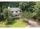 Beautiful two-story home with lush landscaping, offering privacy and charm in a wooded area at 905 Balmoral Dr, Cary, NC 27511