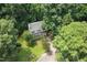 Stunning aerial view of the charming two-story home surrounded by lush greenery in a wooded location at 905 Balmoral Dr, Cary, NC 27511