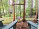 Relaxing backyard area with a colorful disc swing and mature trees at 905 Balmoral Dr, Cary, NC 27511