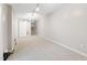 Large basement room with neutral walls, carpet, and lighting, perfect for entertaining at 905 Balmoral Dr, Cary, NC 27511