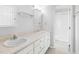 Bright bathroom features dual sinks, a white vanity, and a walk-in shower at 905 Balmoral Dr, Cary, NC 27511