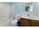 Cozy bathroom featuring a white vanity with a sink, toilet, and tub-shower combo with a white surround at 905 Balmoral Dr, Cary, NC 27511