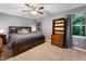 Spacious bedroom featuring a king bed, ceiling fan, and ample natural light at 905 Balmoral Dr, Cary, NC 27511