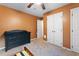 Bedroom with orange walls, neutral carpet, and a large dresser for ample storage at 905 Balmoral Dr, Cary, NC 27511
