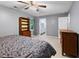 Comfortable bedroom with a paisley comforter, wood furniture, and access to a bathroom at 905 Balmoral Dr, Cary, NC 27511