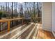Outdoor deck featuring a grill and views of the woods at 905 Balmoral Dr, Cary, NC 27511