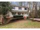 Charming two-story home with a welcoming front porch, red steps and landscaped yard at 905 Balmoral Dr, Cary, NC 27511