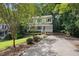 Charming home with inviting front porch and well-maintained landscaping and a long driveway at 905 Balmoral Dr, Cary, NC 27511
