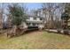 Charming two-story home with a welcoming front porch, red steps and landscaped yard at 905 Balmoral Dr, Cary, NC 27511