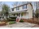 Charming two-story home with a welcoming front porch, red steps and landscaped yard at 905 Balmoral Dr, Cary, NC 27511
