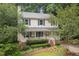 Charming two-story home with a welcoming front porch and beautifully landscaped front yard at 905 Balmoral Dr, Cary, NC 27511