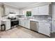Beautiful kitchen with stainless steel appliances, and gray backsplash at 905 Balmoral Dr, Cary, NC 27511