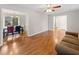 Open-concept space with hardwood floors connecting to the dining area for easy entertaining at 905 Balmoral Dr, Cary, NC 27511