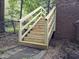 Newly constructed wooden staircase leading up to the house from the yard at 905 Balmoral Dr, Cary, NC 27511