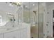 Bathroom with glass enclosed shower, white vanity, and a large mirror with lights at 100 Maywood Way, Chapel Hill, NC 27516