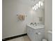 Clean bathroom featuring white vanity, large mirror, and contemporary lighting at 100 Maywood Way, Chapel Hill, NC 27516